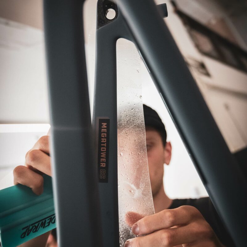 DSC_3987-2 RideWrap protection kit being applied to bike chainstays.